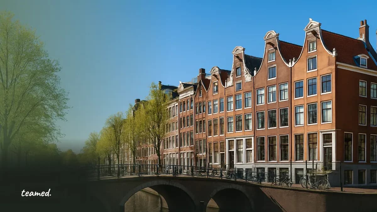 An Amsterdam canal lined with Dutch houses, representing Employer of Record services in the Netherlands.