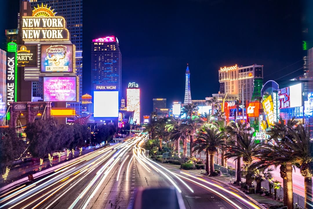 Las Vegas, Nevada downtown skyline at night, city towers glowing with amber and blue light.