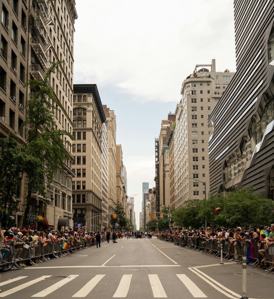 Busy New York City street with pedestrians and yellow taxis in Midtown Manhattan