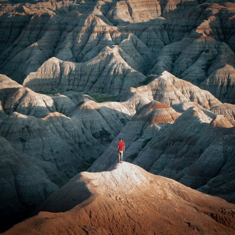 South Dakota Badlands, open prairie under wide blue sky.