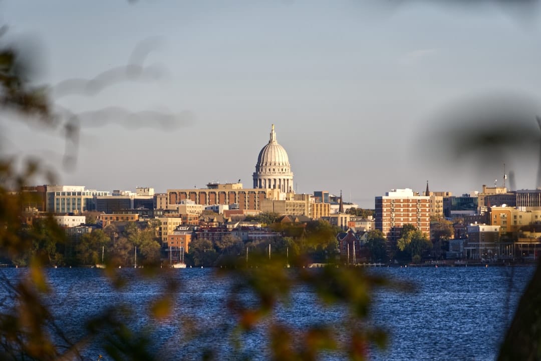 Madison, Wisconsin state capitol building reflected in the lake at dusk.