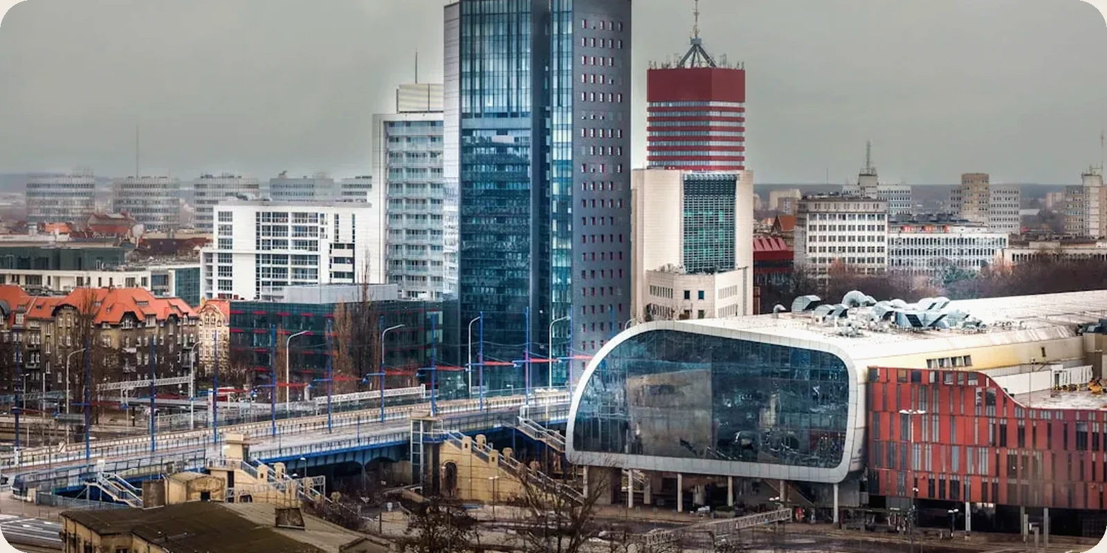 A Polish city skyline with historic and modern buildings.