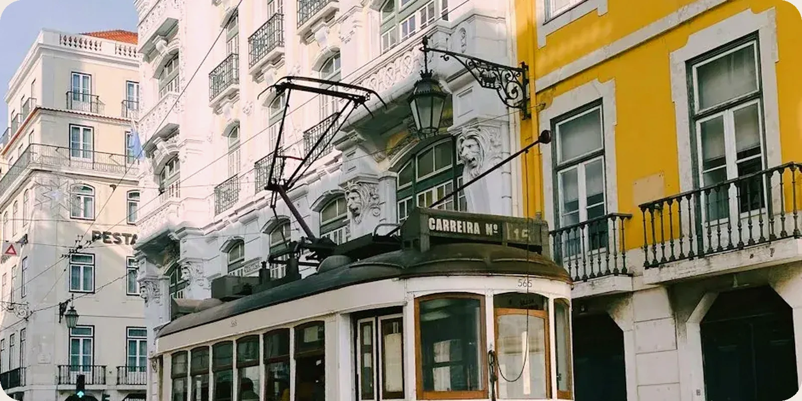 A Portuguese residential street with tiled facades and balconies.