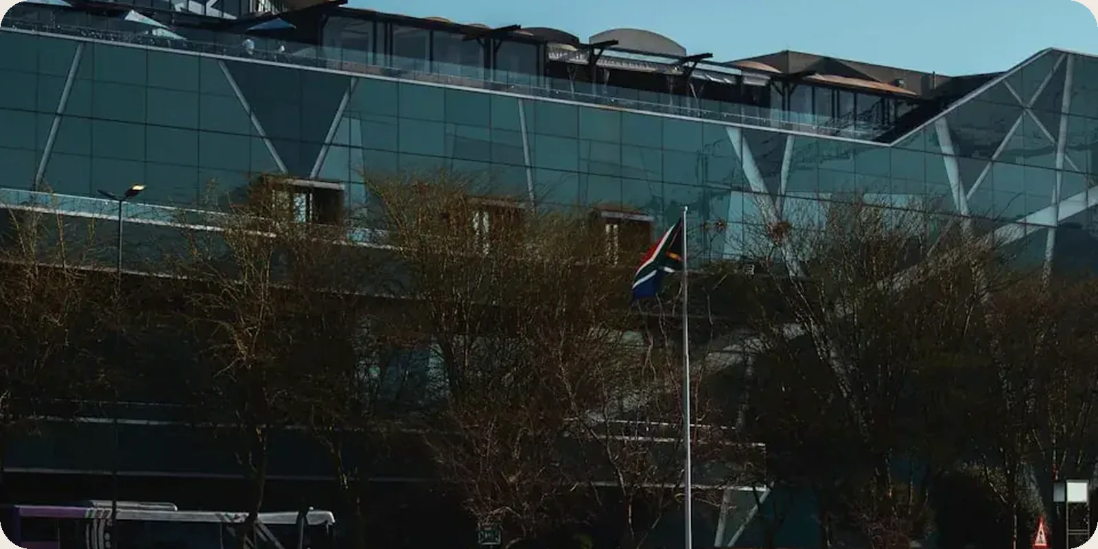 A South African city street with Table Mountain in the distance.