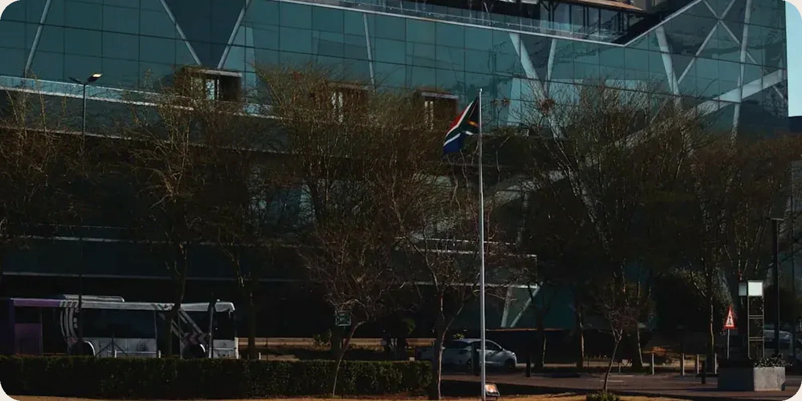 A South African street scene with people and city buildings.
