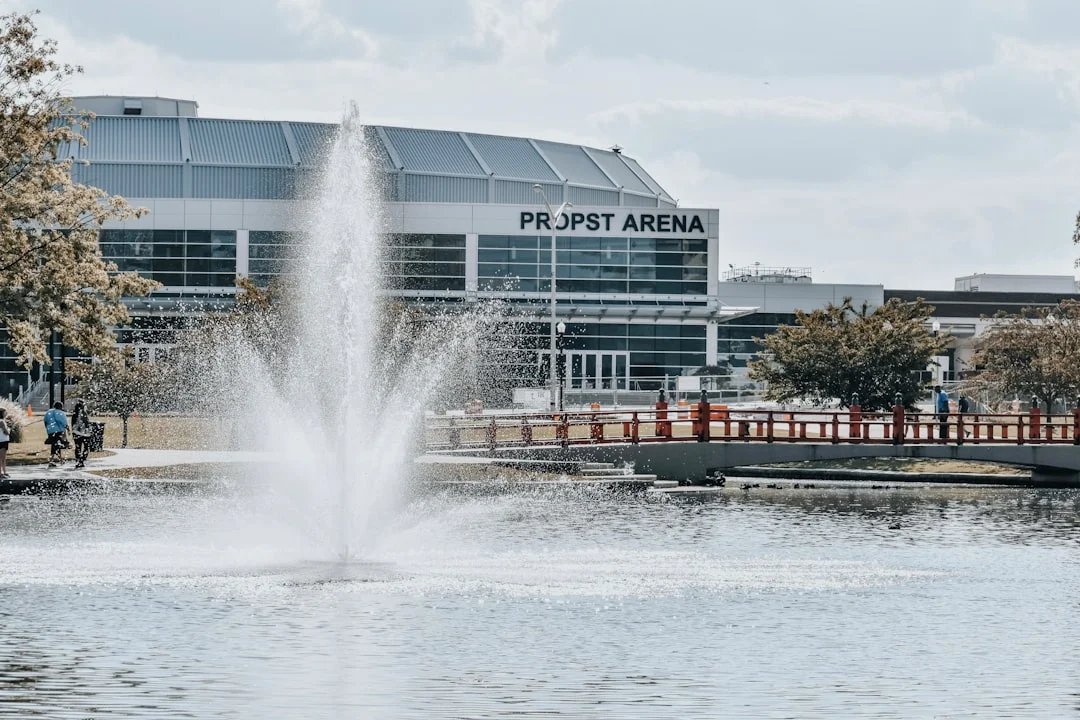 A civic fountain in front of a large public building in Huntsville, Alabama, photographed in daylight.