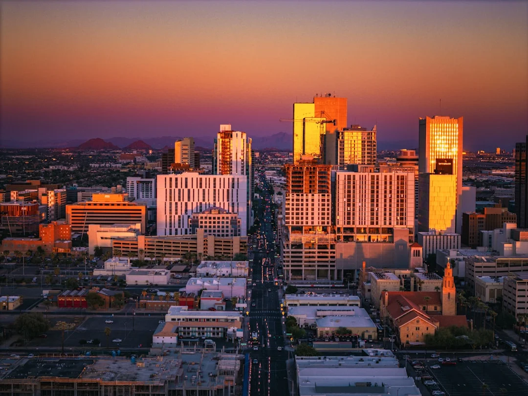 Phoenix, Arizona downtown skyline with modern office buildings under clear desert sky.