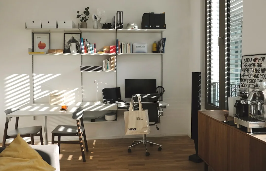 A tidy desk in a bright Copenhagen office with a signed letter, a fountain pen and a coffee cup.