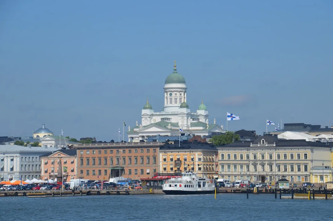 Helsinki harbour at dusk with the cathedral and market square under soft northern light.