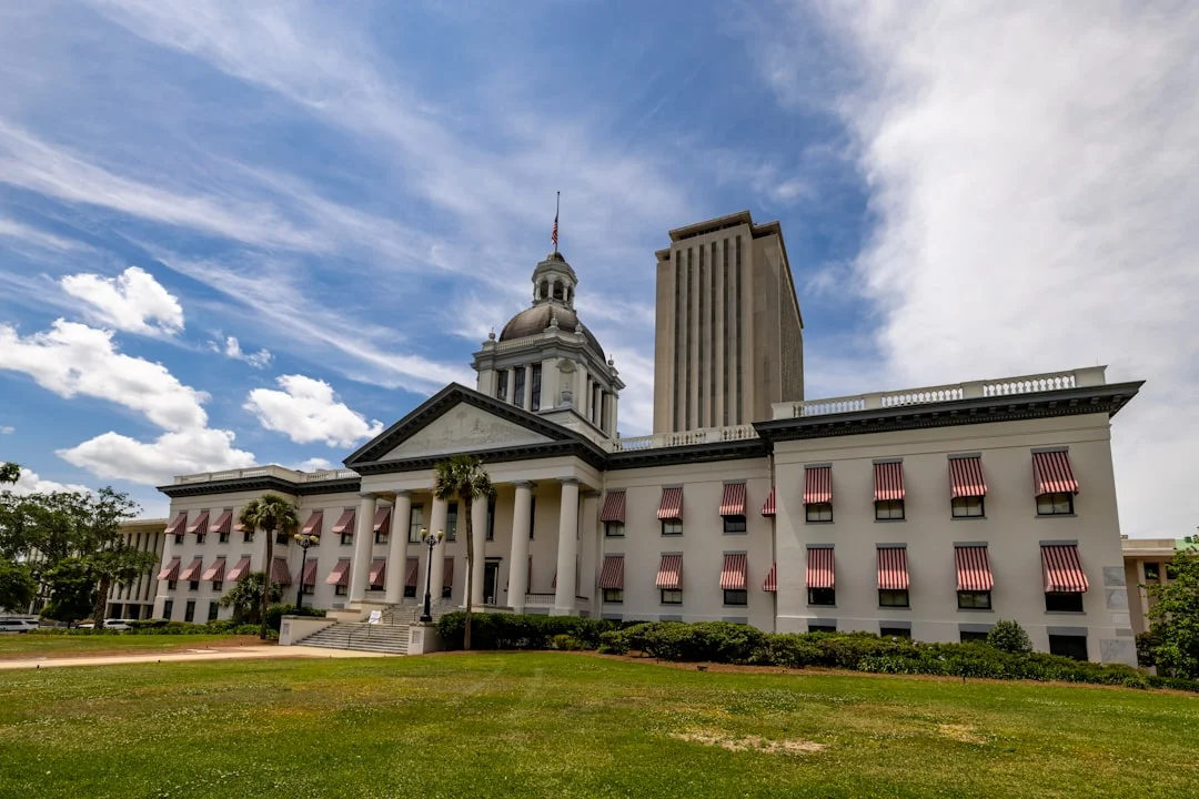 The Florida State Capitol building in Tallahassee, photographed in daylight against a blue sky.