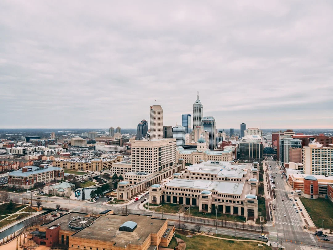 Aerial view of downtown Indianapolis, Indiana, with city buildings in daylight.