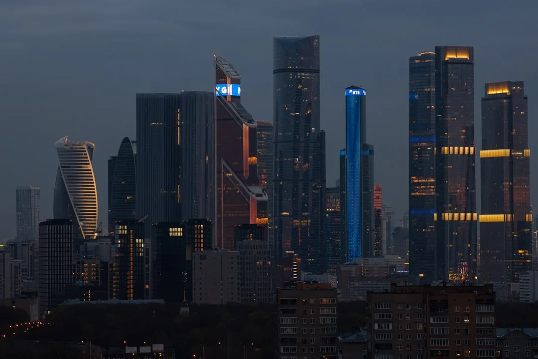 A wide view of a Moscow city boulevard lined with Soviet-era buildings under a pale winter sky.