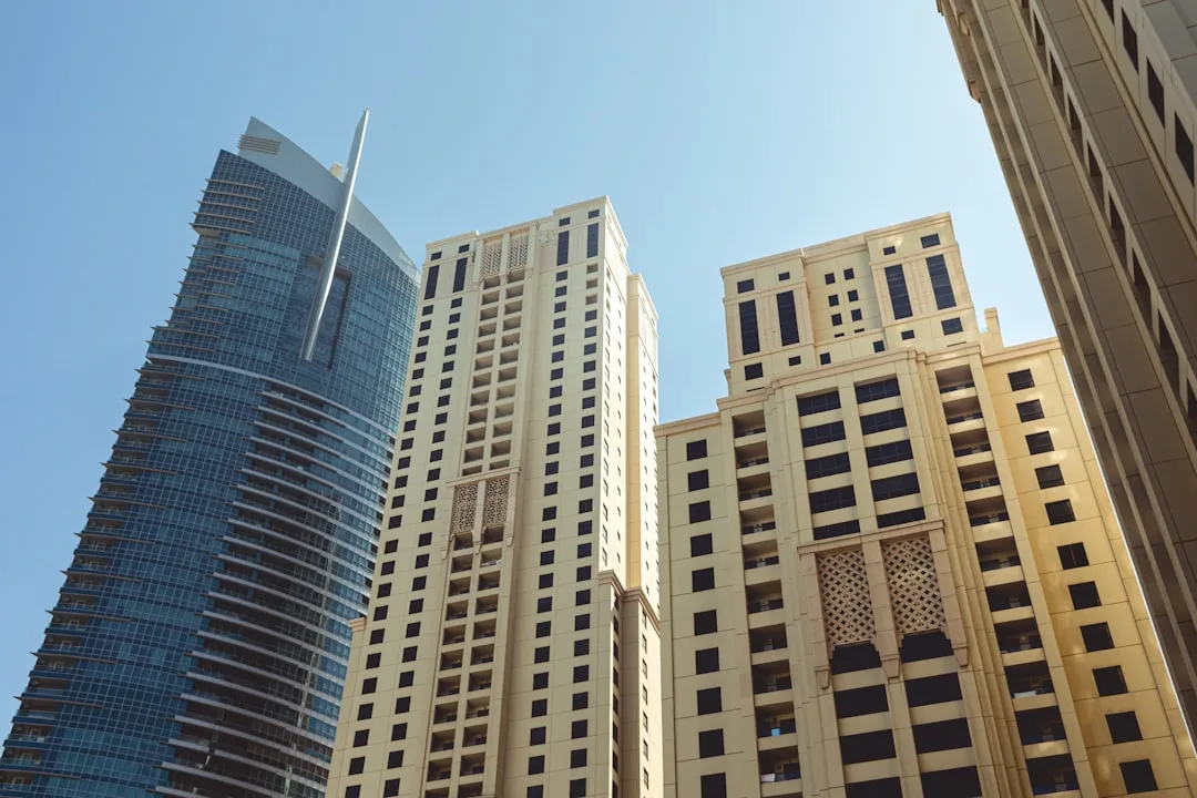 A wide view of the Dubai skyline at dusk with the Burj Khalifa in the background.