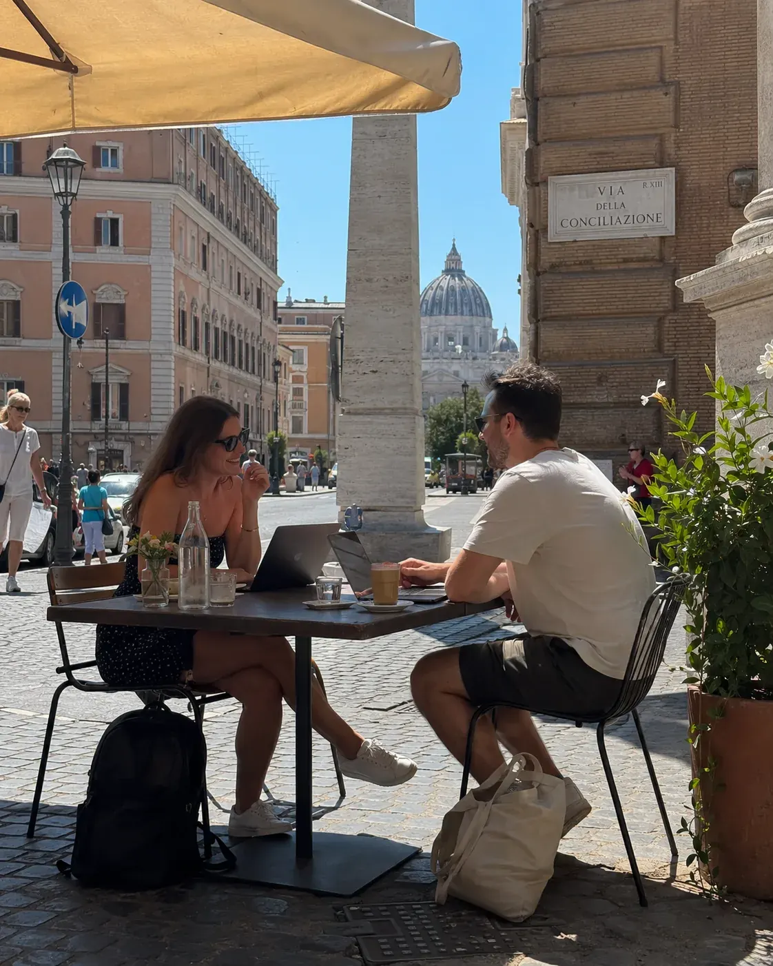 Two contractors working at a café in Rome