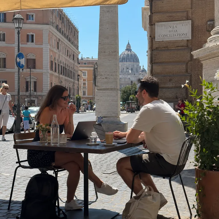 Teamed travellers at a café in Rome, Italy