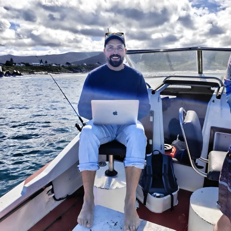 A Teamed traveller working from a boat in South Africa